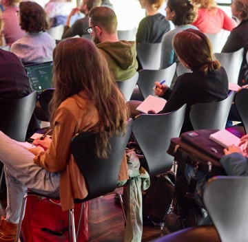 Participants of a conference during a lecture